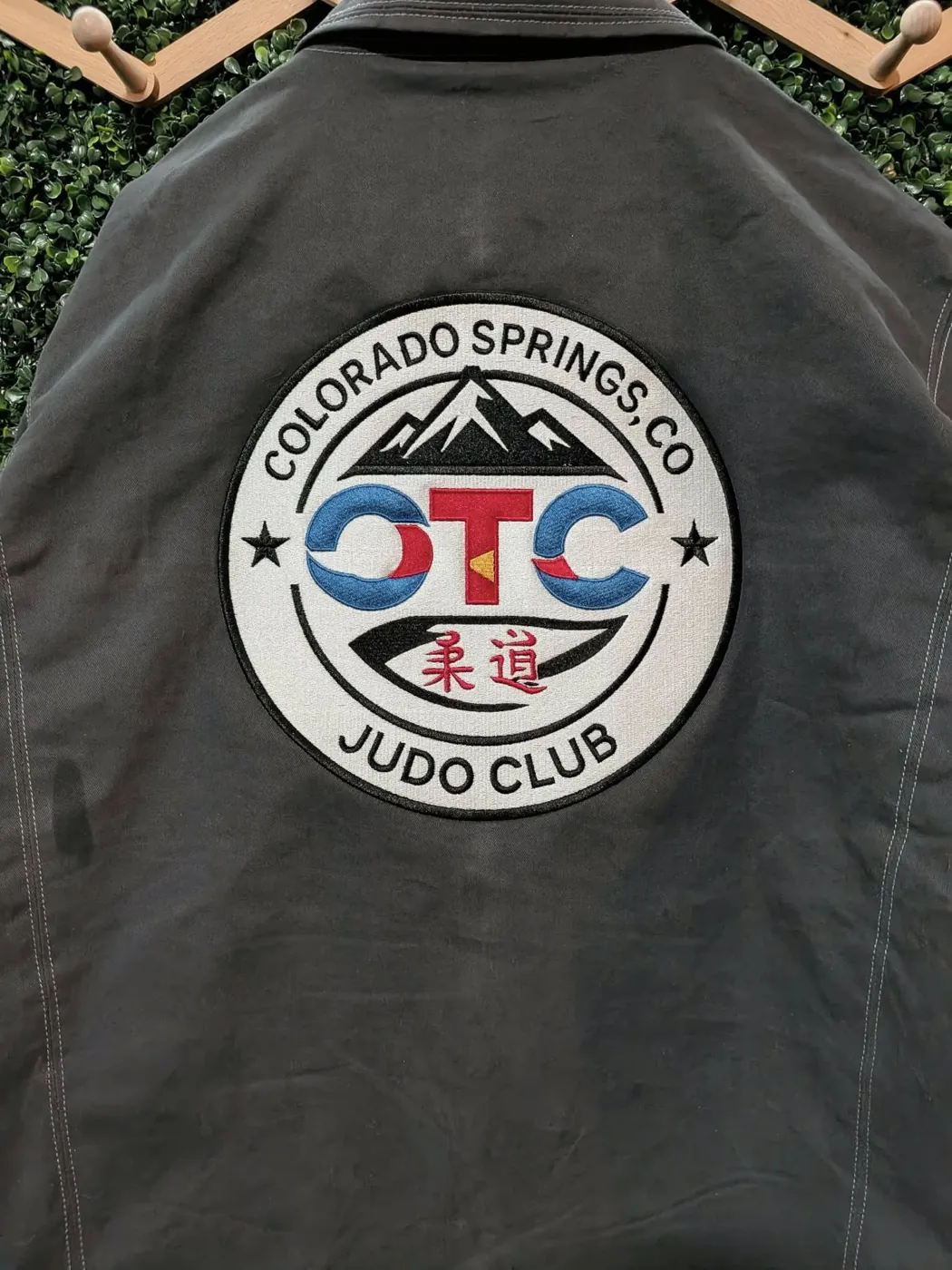 Embroidered judo club jacket with a custom circular embroidered patch